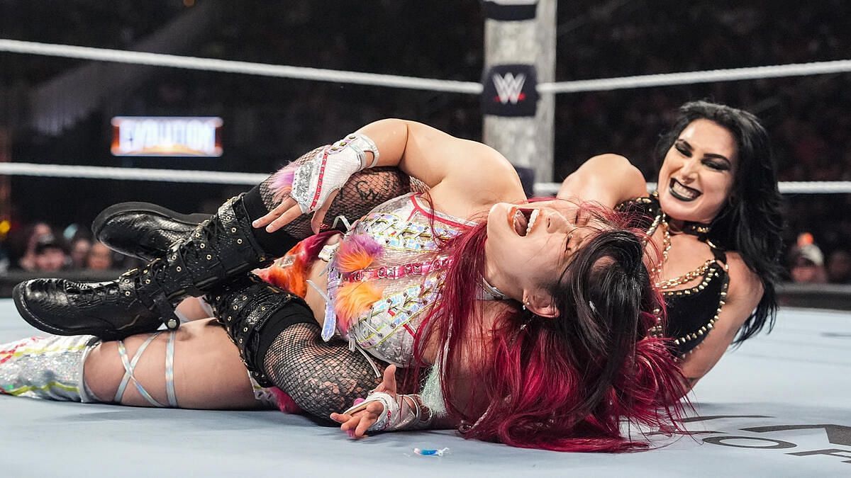 IYO SKY and Rhea Ripley during their match at Evolution. (Image credits: wwe.com)